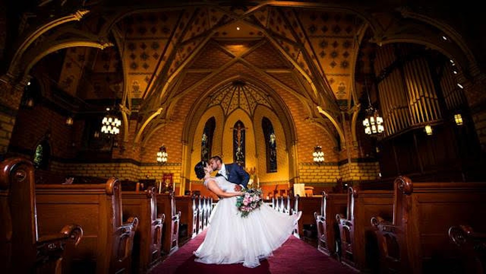 Couple kissing in a church