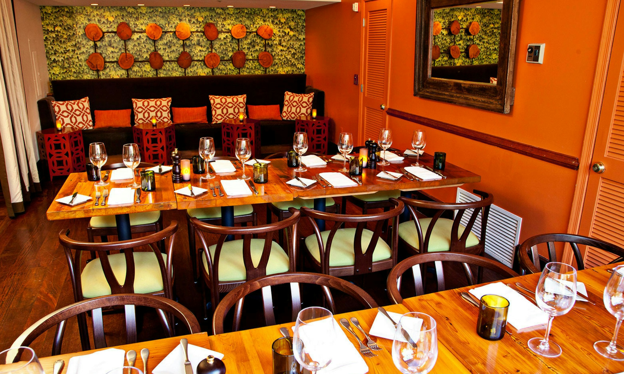 bright orange walls and colorful tile create a fun dining room at kimpton hotel madera