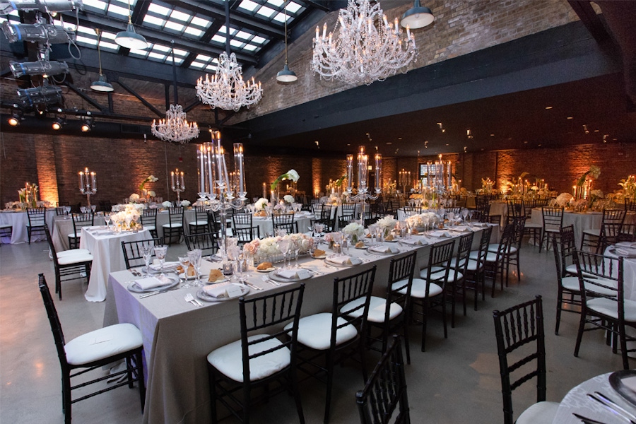 Exposed brick with hanging chandeliers