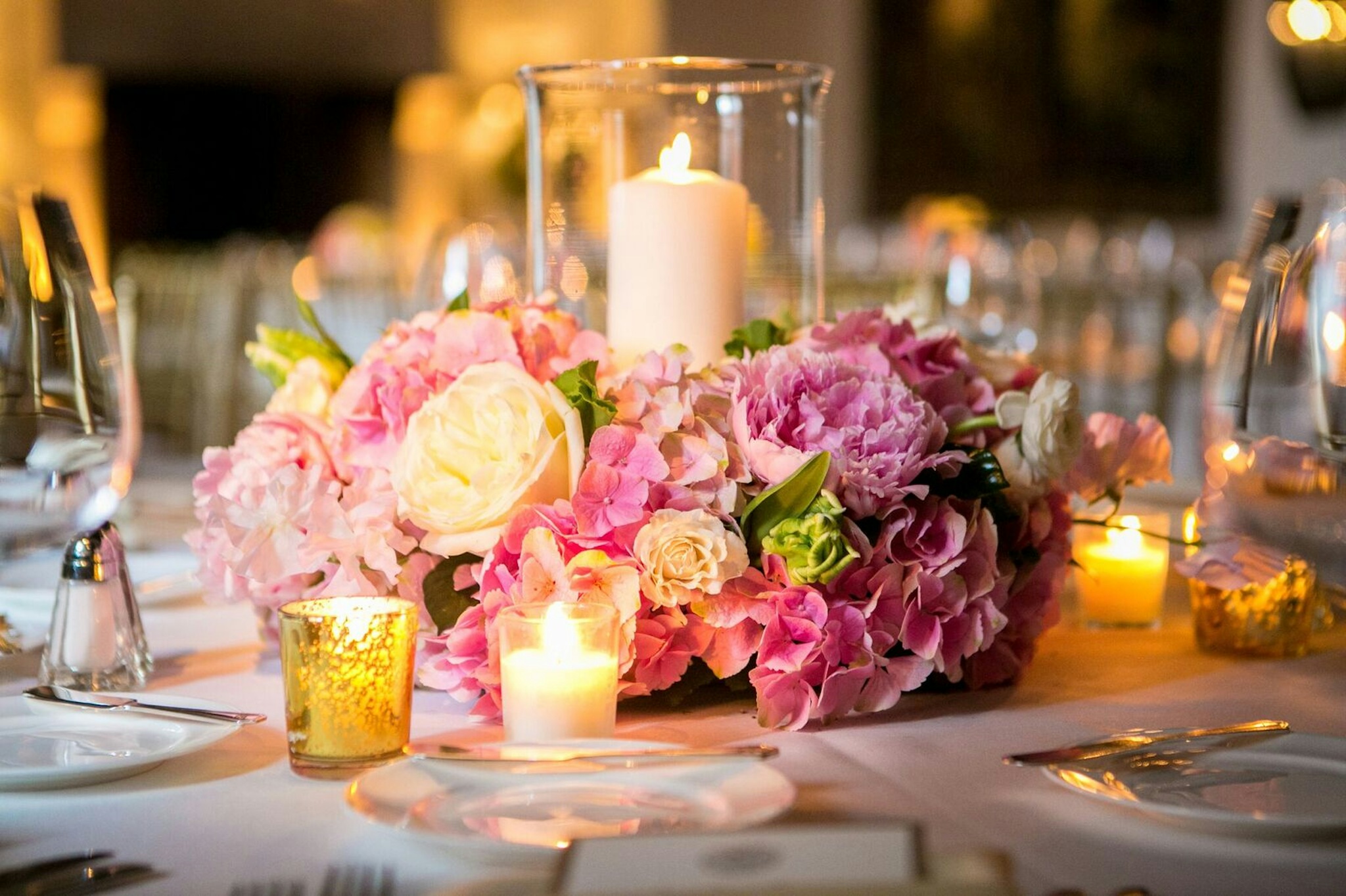 candlelit floral arrangement centerpiece