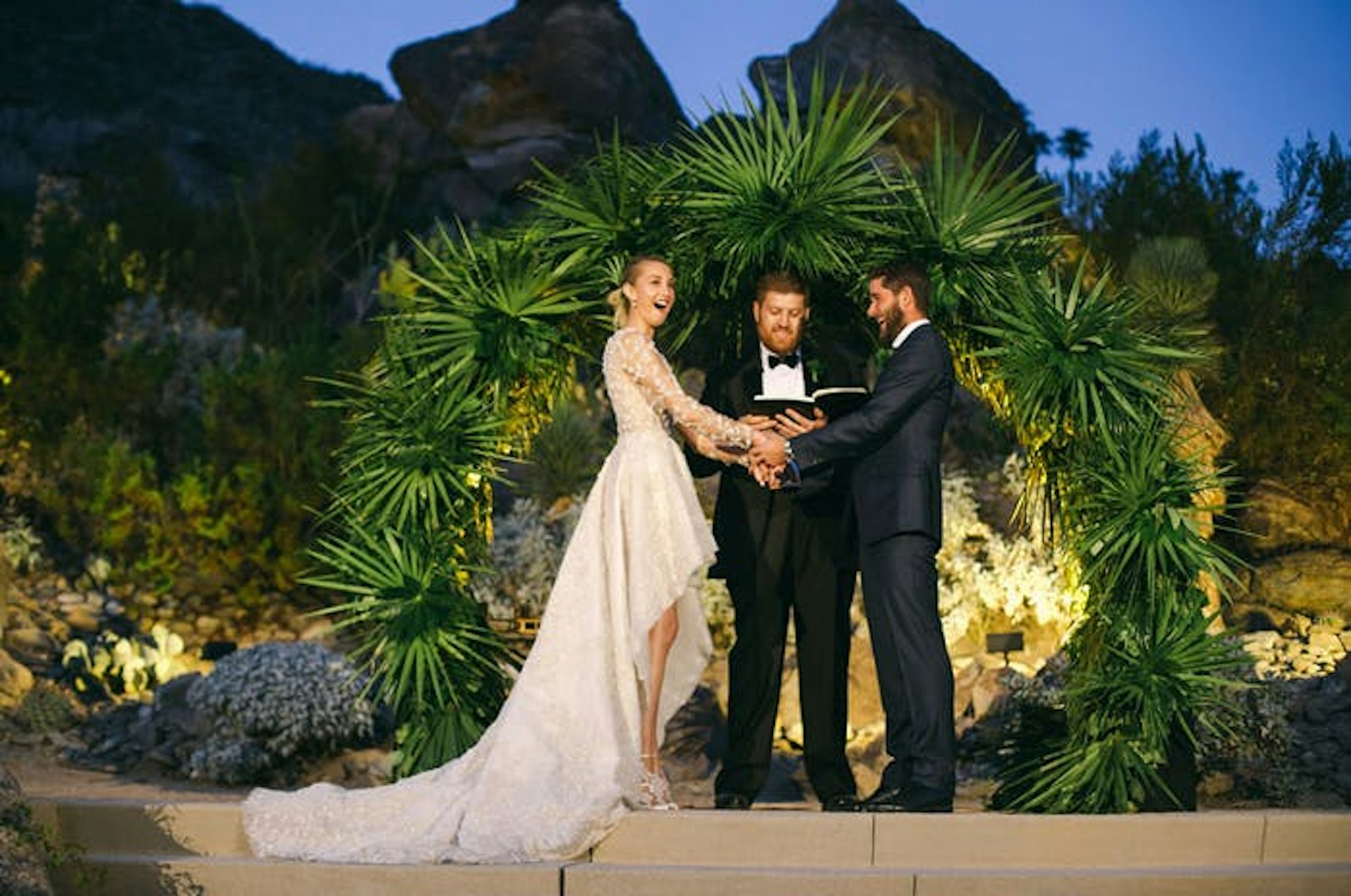 Circular wedding arch with bride and groom