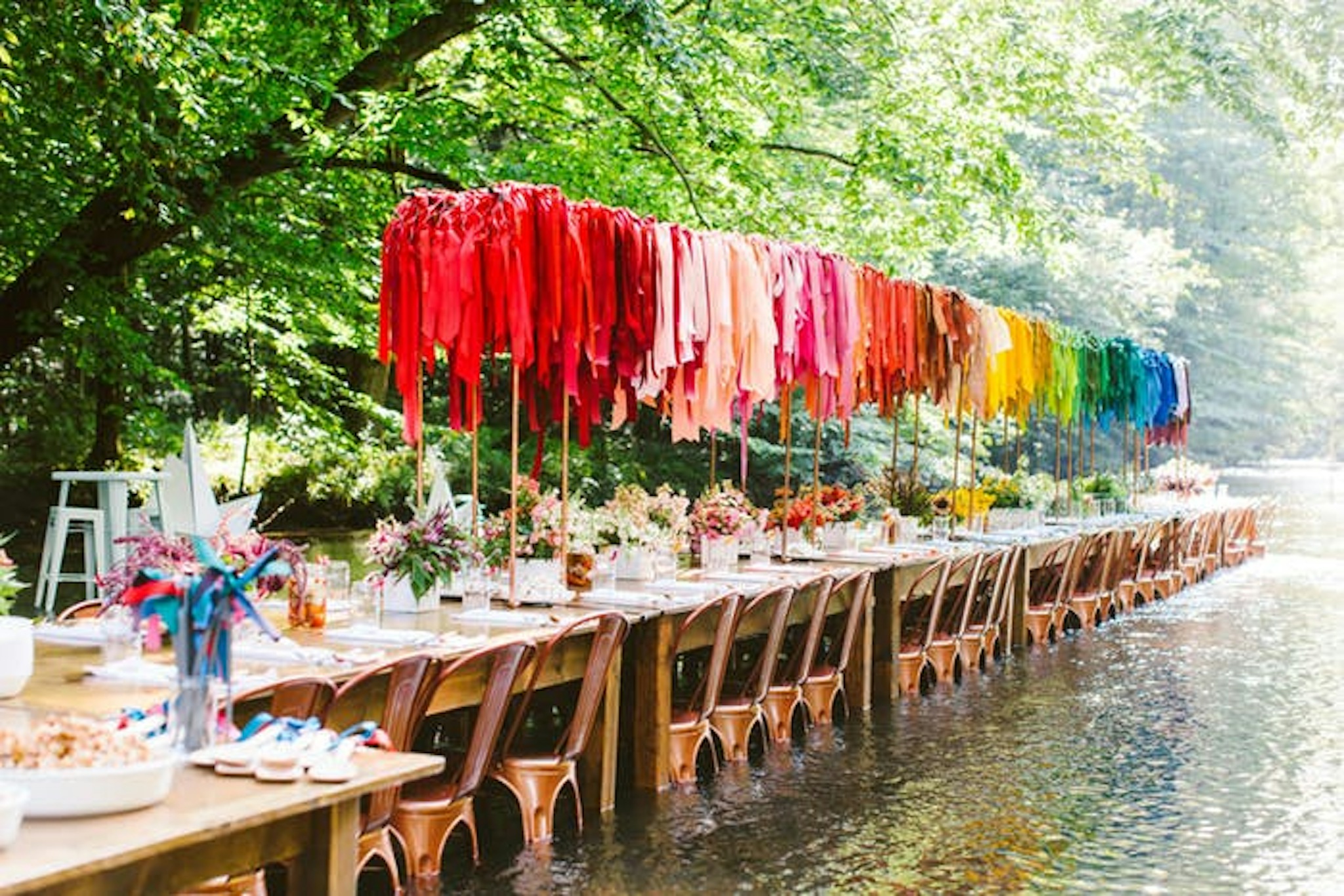 Outside wedding with colorful clothing table decor