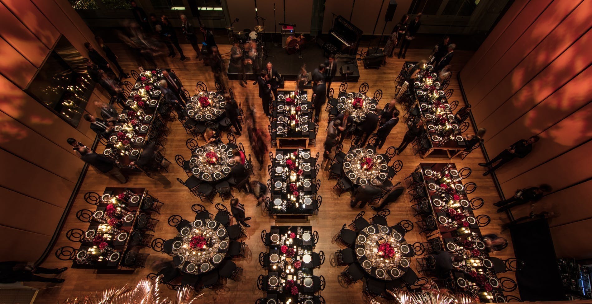 Birds eye view of round and long tables at Carnegie Hall ballroom | PartySlate