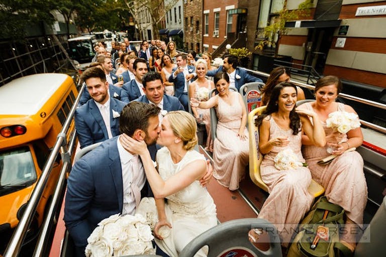 Bridal party and groomsman celebrating on a party bus touring around NYC | PartySlate