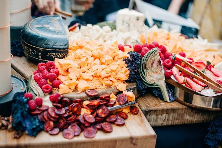 Overflowing cheese and fruit board | PartySlate