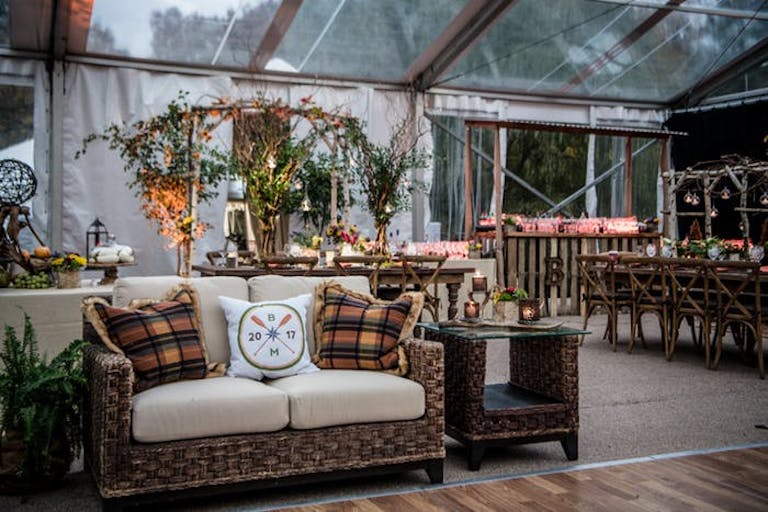 Rustic furniture and willow branch sculptors at camp-themed Bar Mitzvah | PartySlate