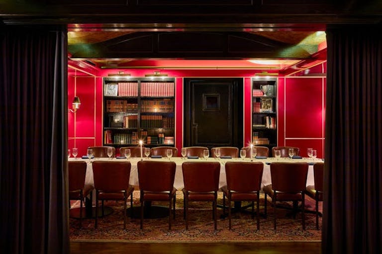 Red walls and chairs in private room at Tortoise Supper Club | PartySlate