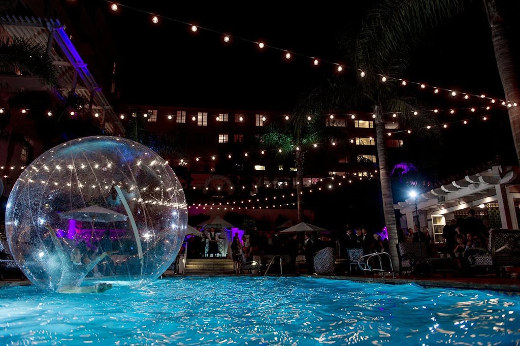 Bubble dancer performing in AcroShere on pool