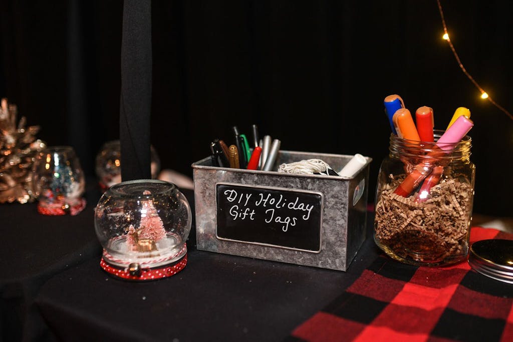 crafting station for snow globes and holiday gift tags | PartySlate