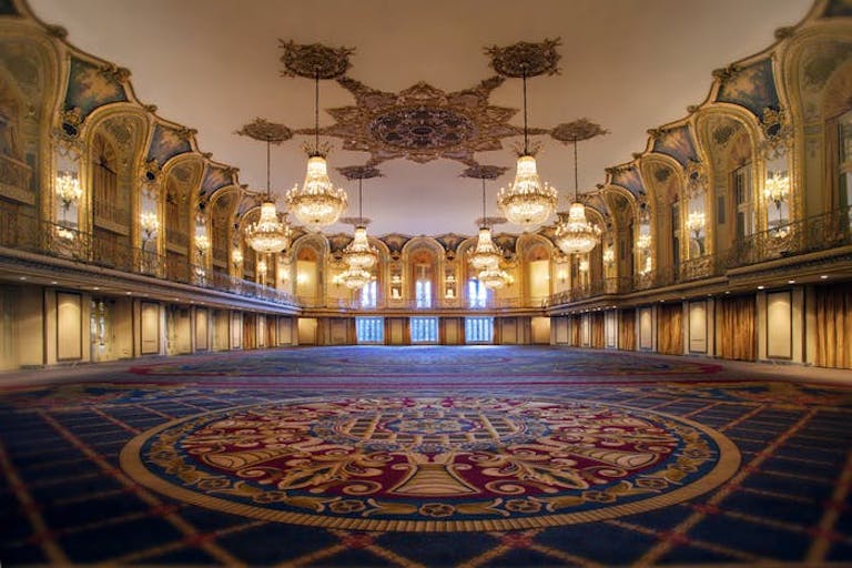 Grand ballroom with chandeliers and floor art at the Hilton in Chicago | PartySlate