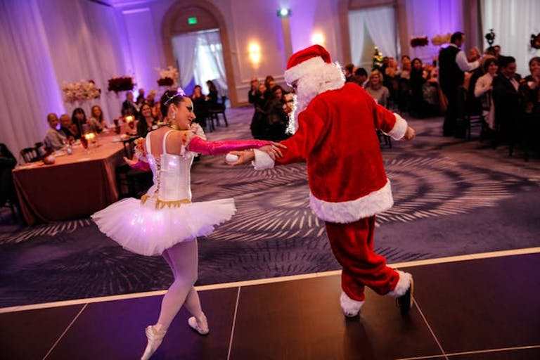 Santa and ballerina dance at corporate holiday part at Four Seasons San Francisco | PartySlate
