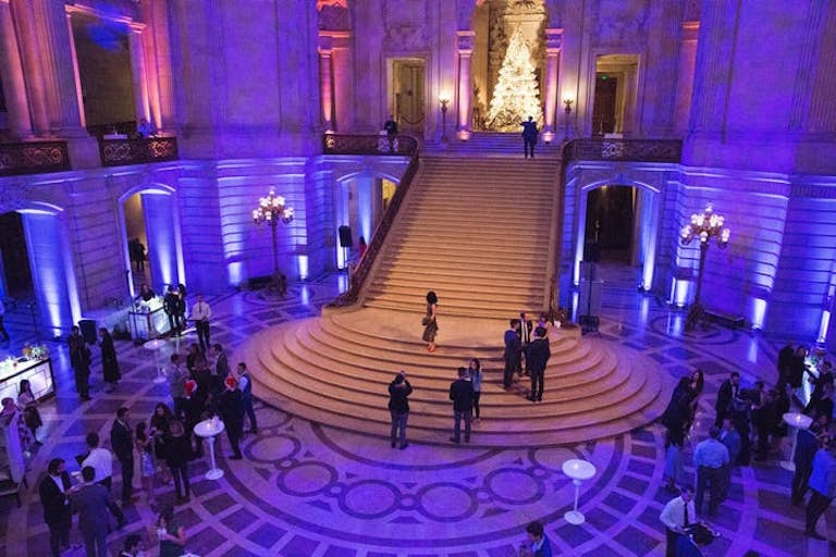 Corporate holiday party with blue lighting at San Francisco City Hall | PartySlate