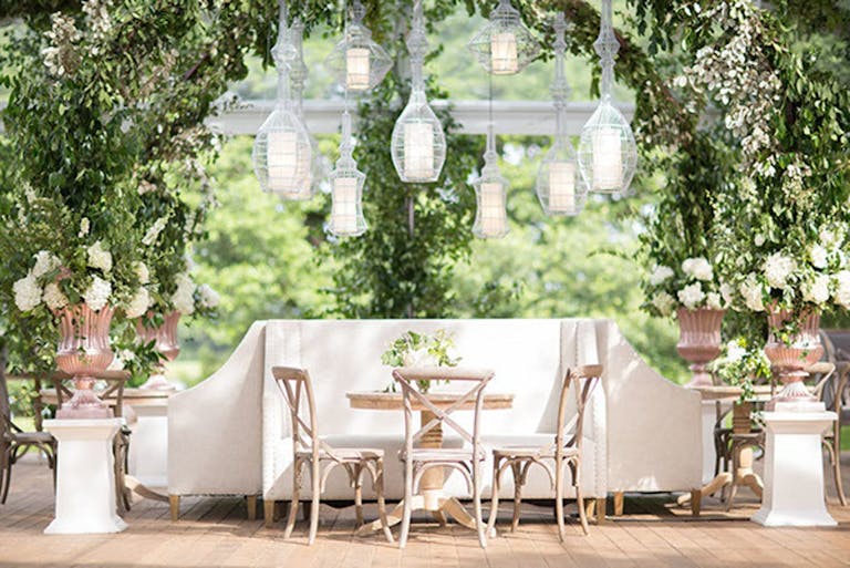 Intimate dining area with suspended, globed lighting | PartySlate