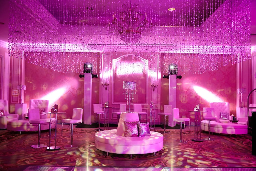 Dance floor with pink uplighting and lounge area