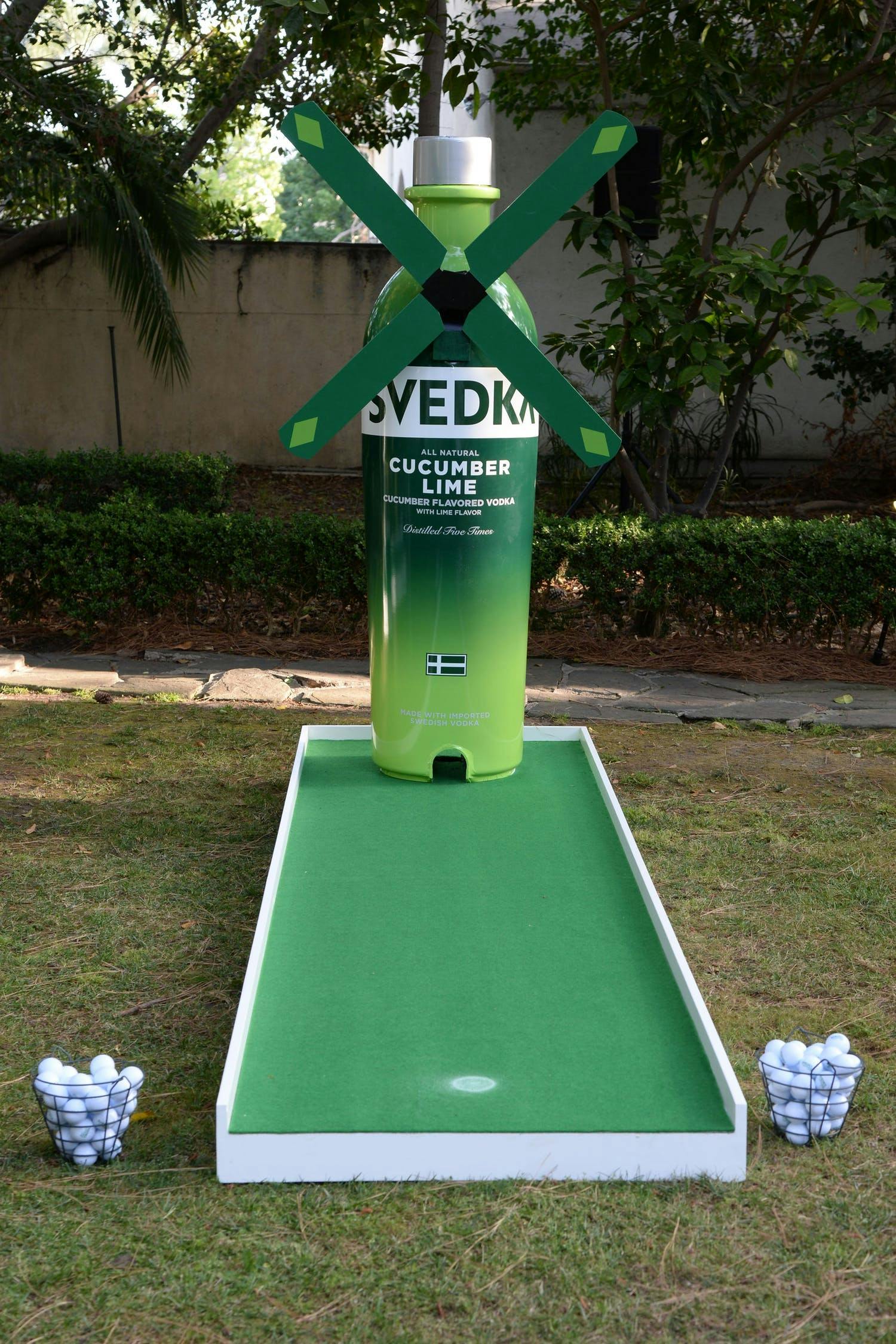 mini golf hole with SVEDKA backdrop