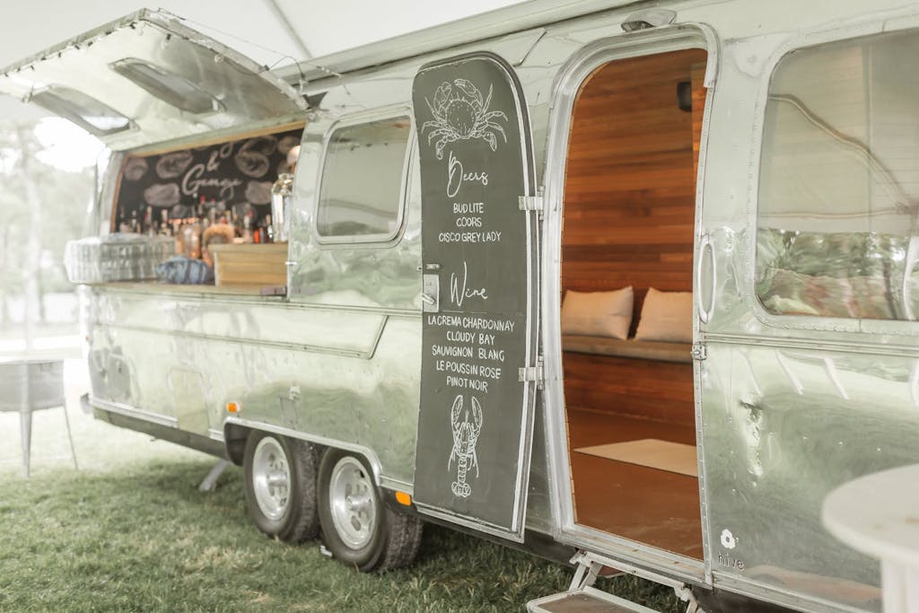 Airstream bar at an outdoor wedding rehearsal dinner | PartySlate