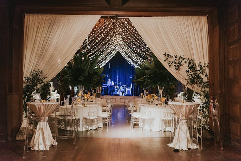 reception area with white drapes and canopy of twinkling lights