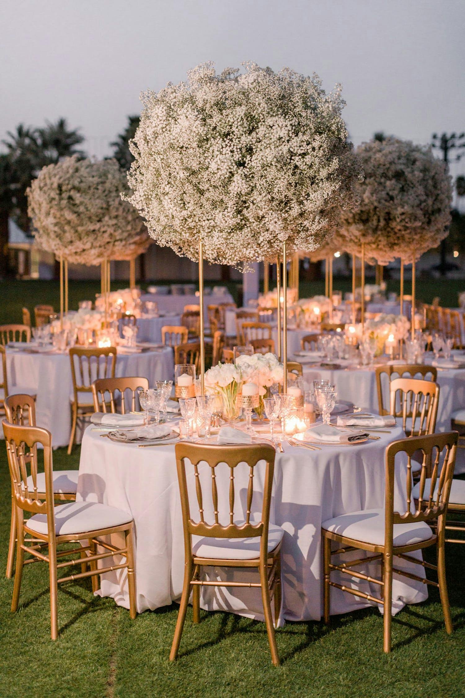 tables with towering baby's breath floral centerpieces