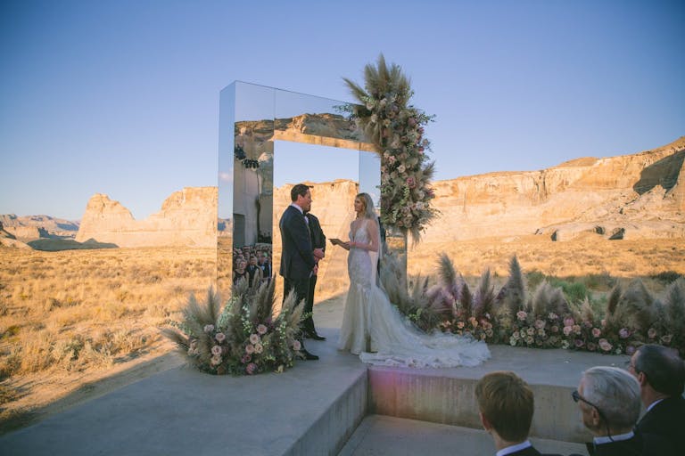 dessert wedding ceremony with mirrored archway