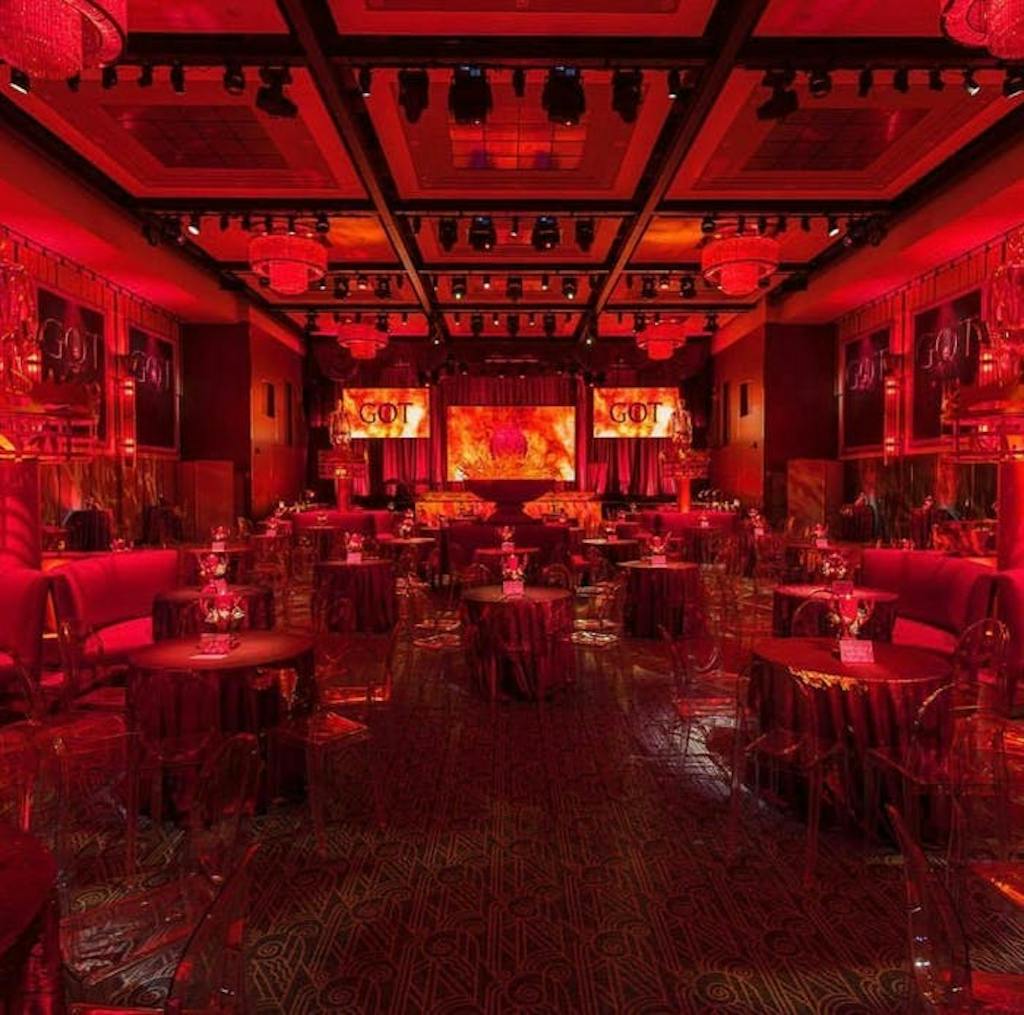a venue with a great deal of depth with red uplighting taking over the scene