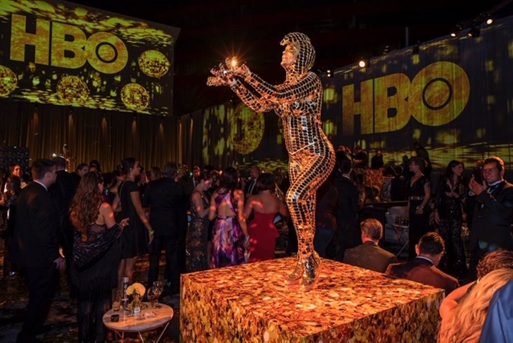 HBO Emmy after-party with performer wearing metallic bodysuit