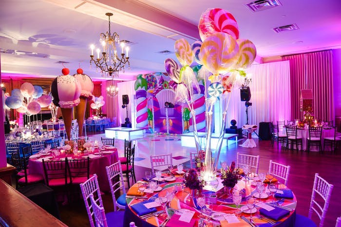 tables with giant lollipop and ice cream installations