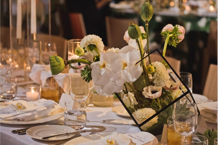 low orchid wedding centerpieces with intricate floral arrangements