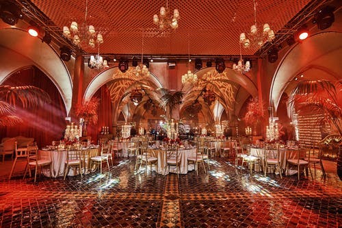 Morocco 50th Birthday Party With Red and Orange Uplighting | PartySlate