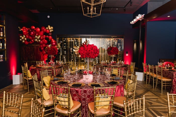 Milestone Birthday Party With Red and Gold Tablescapes and Décor | PartySlate