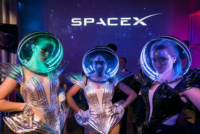 Galaxy-Themed Party With Three Women in Silver Space Costumes and Multicolored Space Helmets | PartySlate