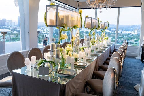 Tablescape With Candle Light, Calla Lilies, and Dramatic City Views | PartySlate