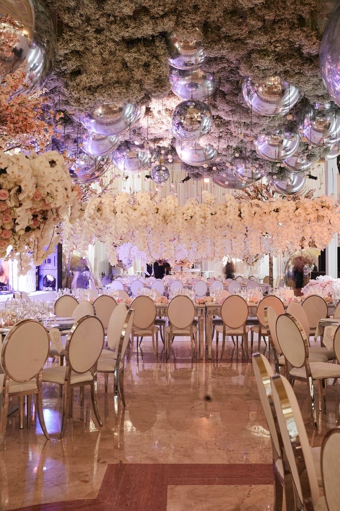 A room covered with ceiling florals and raised floral ceterpieces