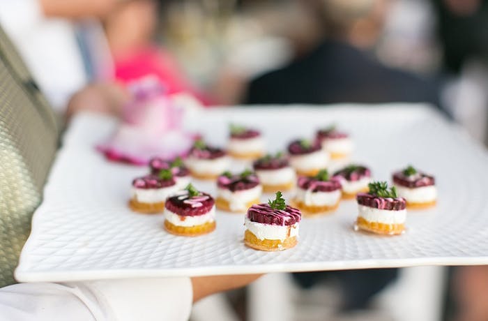 appetizer tray with small bites of purple