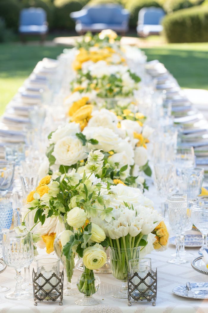 White and yellow floral centerpieces