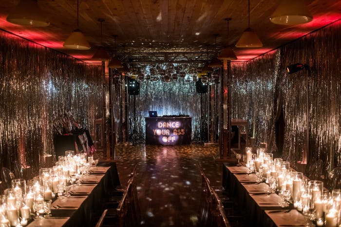 A rectangular room with shimmer draping on all sides for Disco-themed party | PartySlate