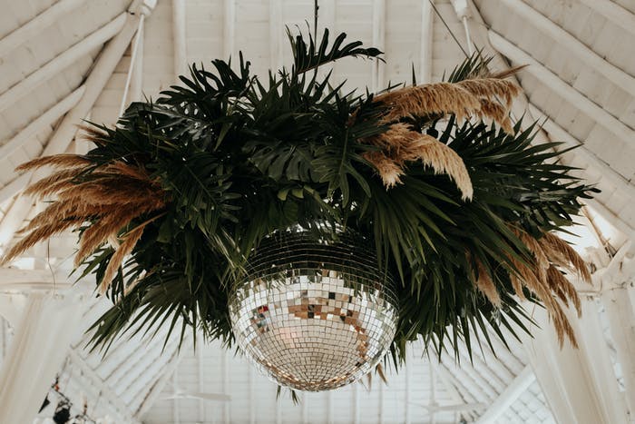 Tented Ceiling Installation with Tropical Disco Ball Ceiling Fixture | PartySlate