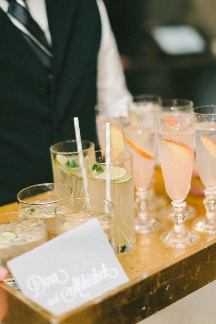 drink tray with pink and yellow drinks with paper straws