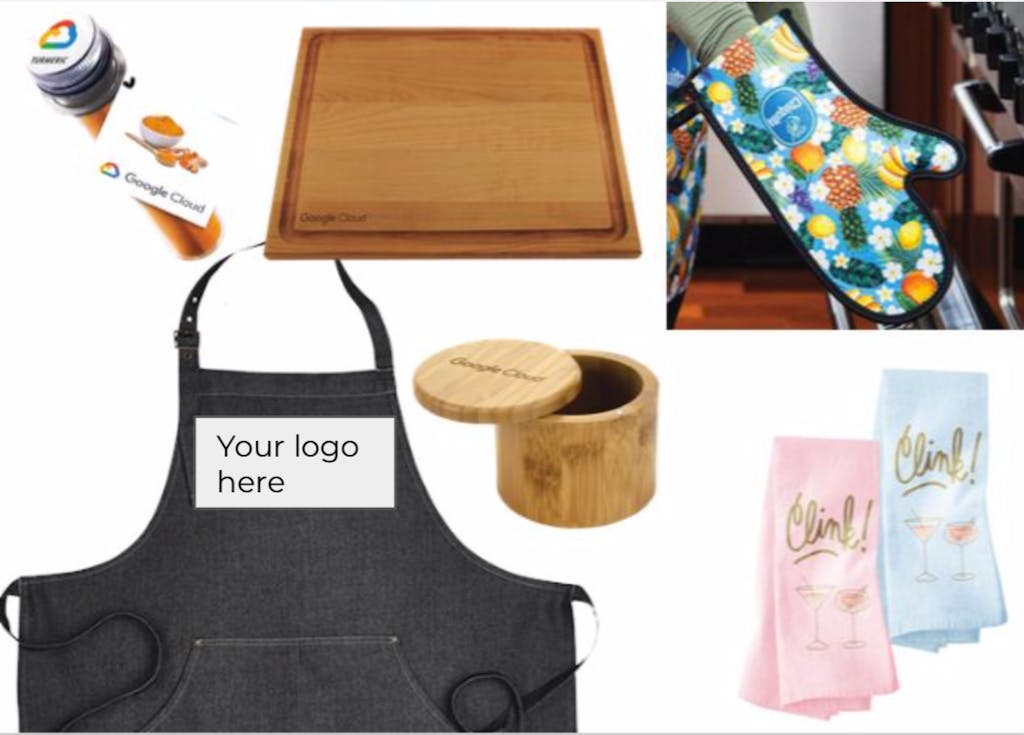 A photo of various swag that includes a black apron, a floral oven mitt, a wooden cutting board, two champagne towels, a wooden salt container, and a container of spice.