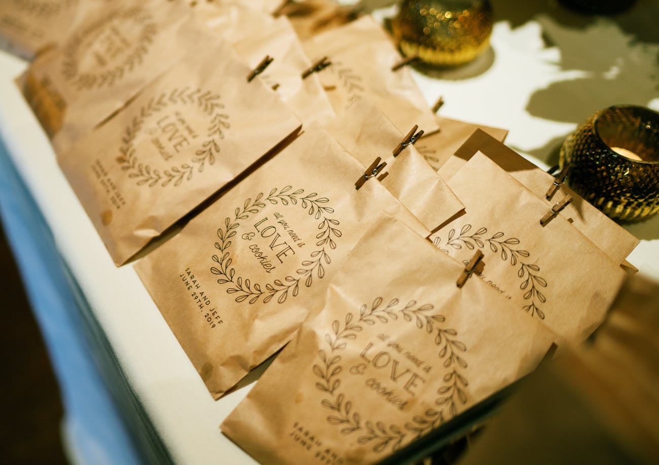 Take-home cookie wedding party favors with custom packaging.