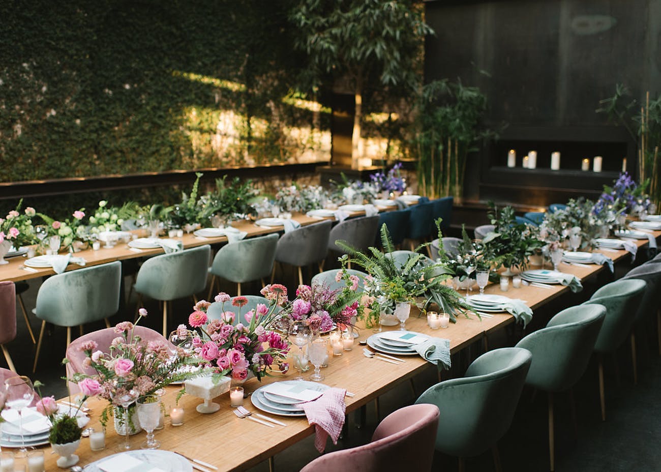 Corporate dinner party with earthy tones and pink floral centerpieces | PartySlate