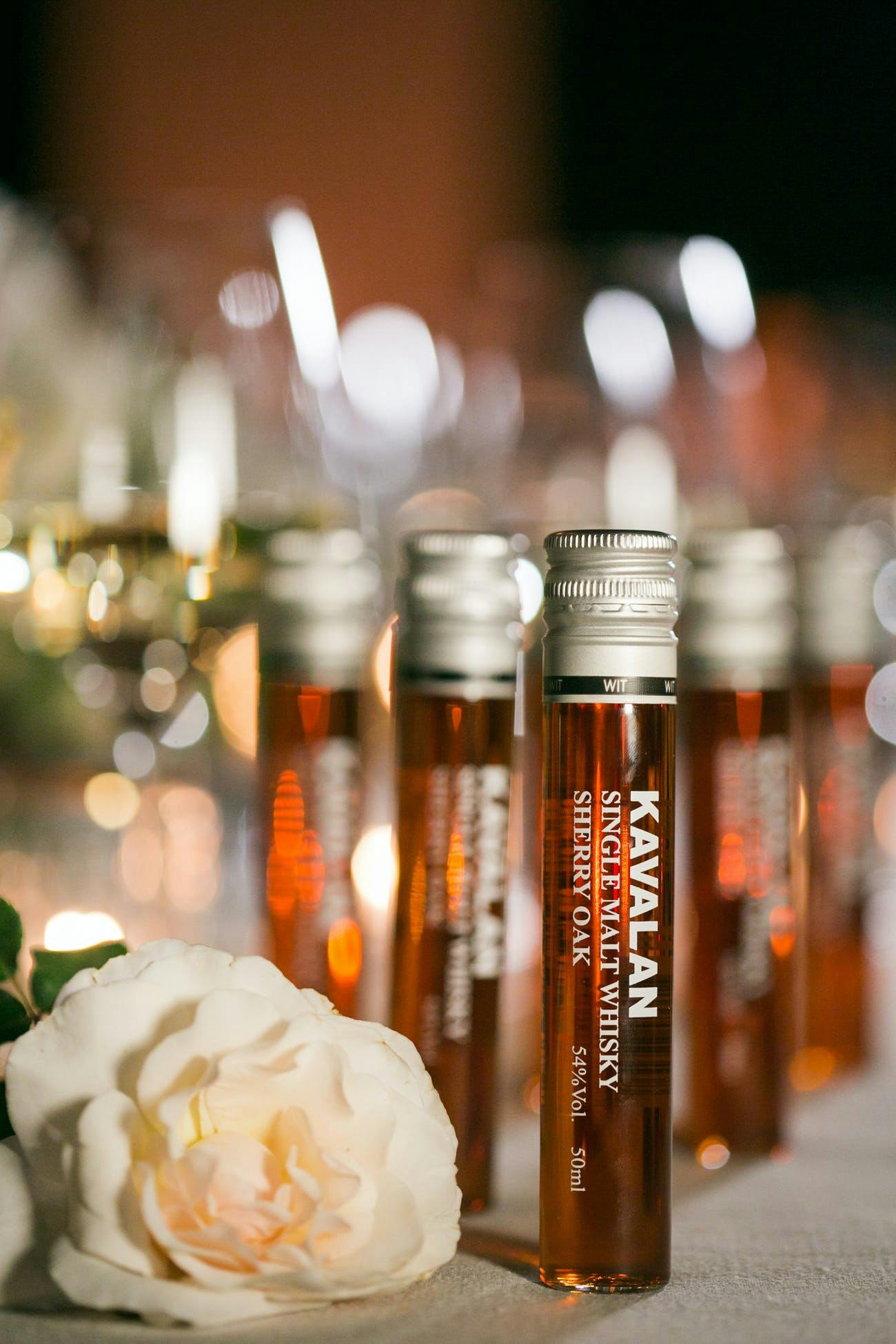 Single-serve malt whiskey wedding party favors.