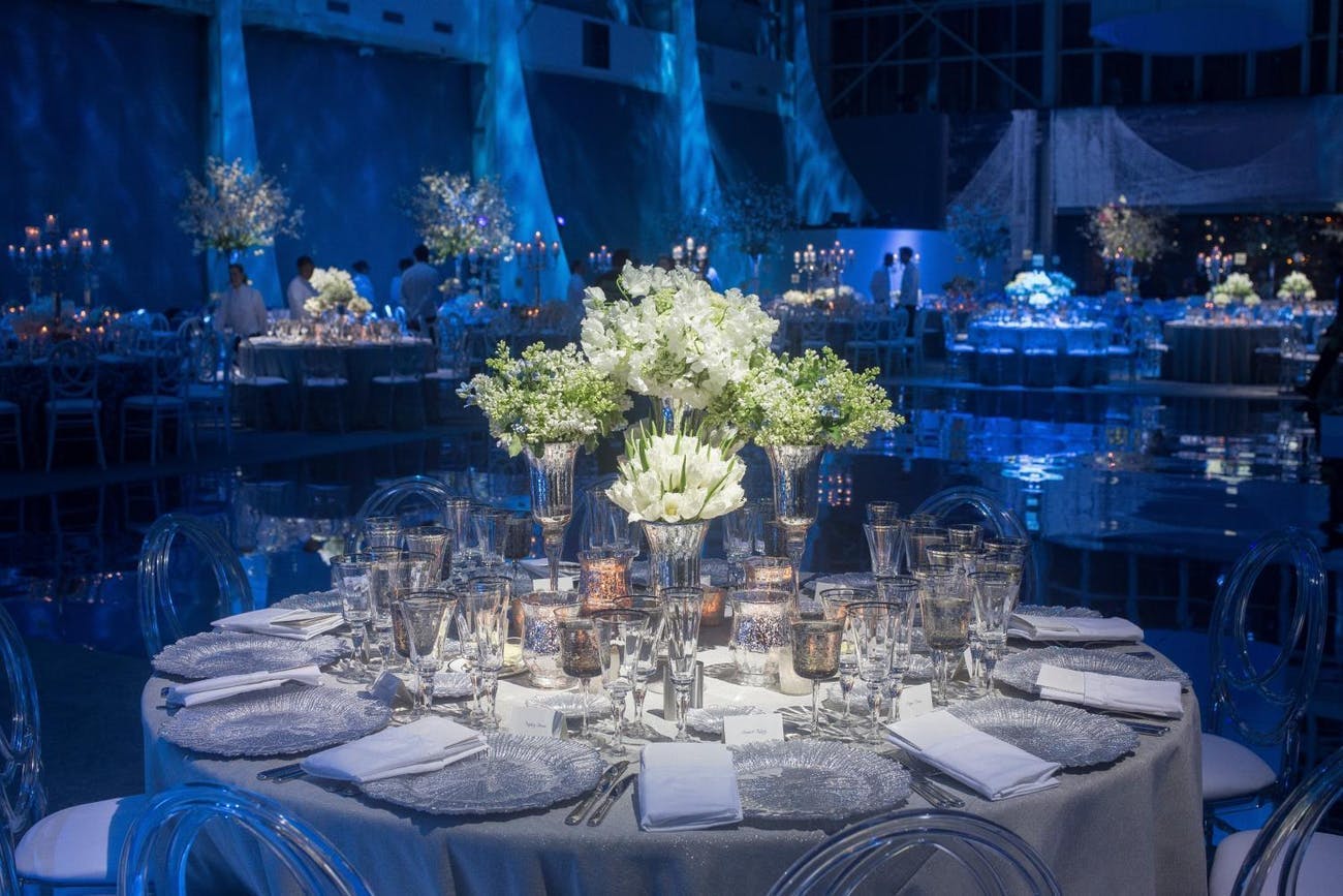 Corporate dinner party with contrasting blue and white color décor | PartySlate