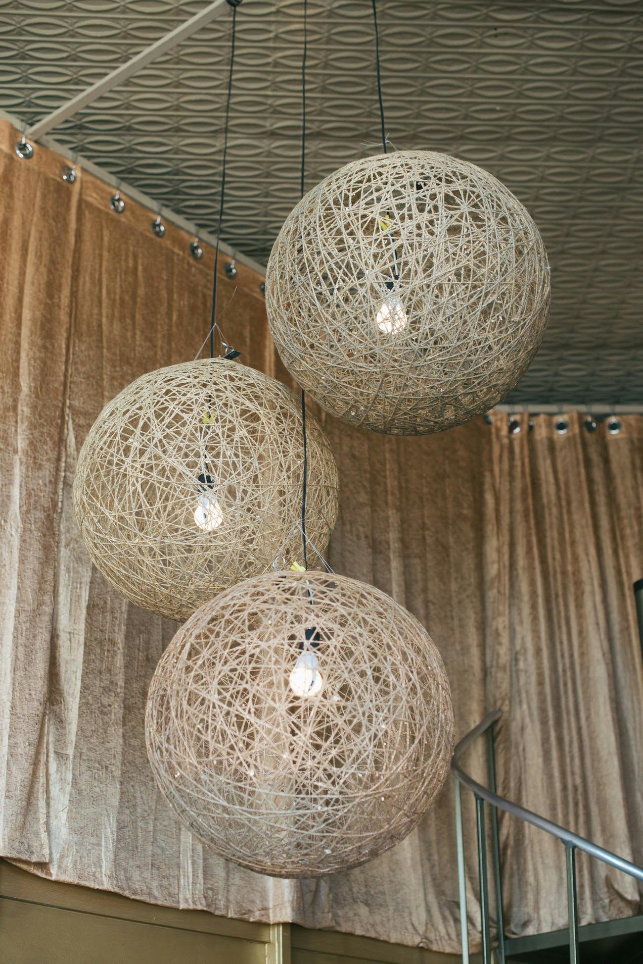 White round rattan wicker chandeliers | PartySlate