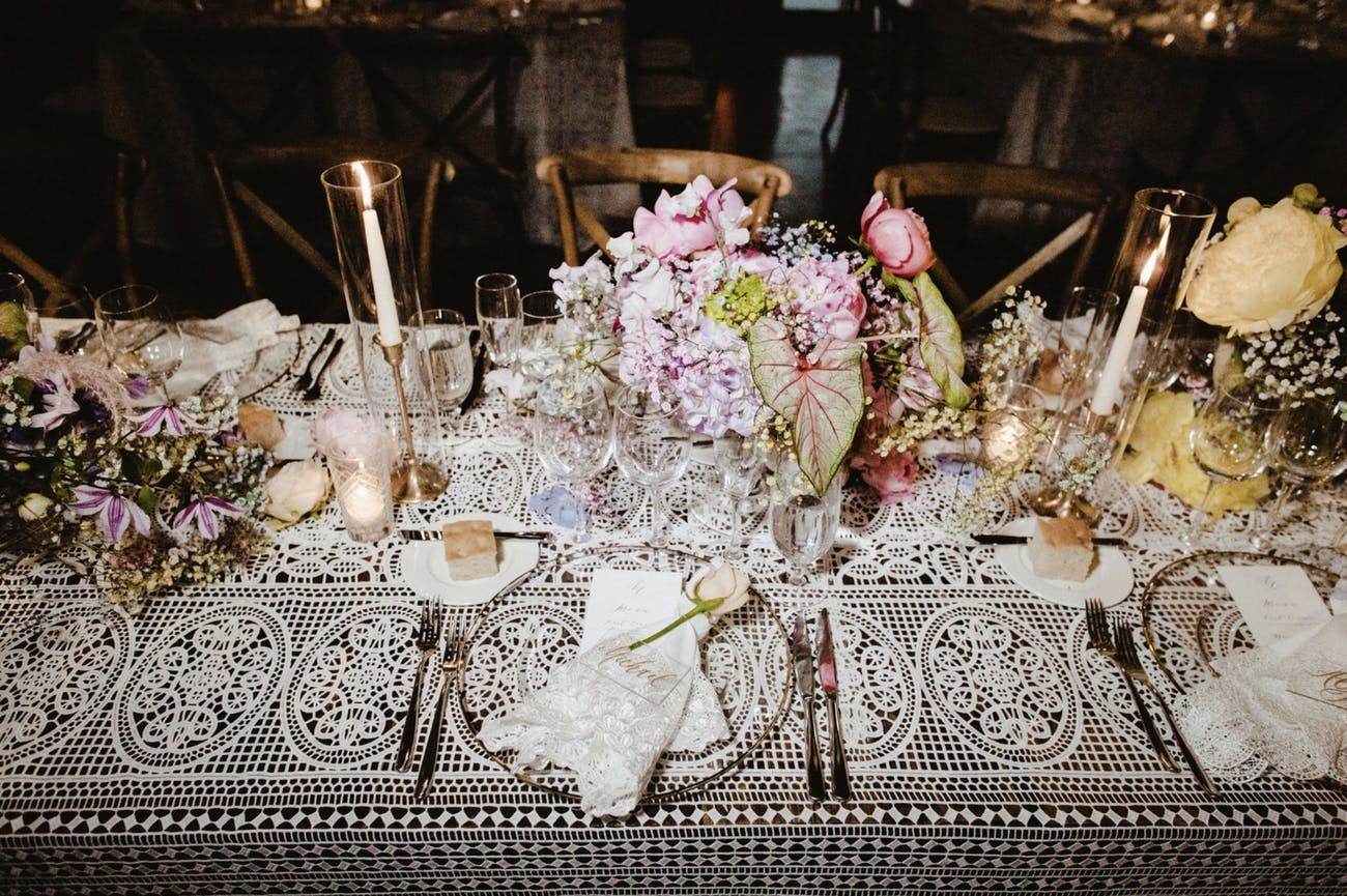Vintage wedding tablescape with lace linen.