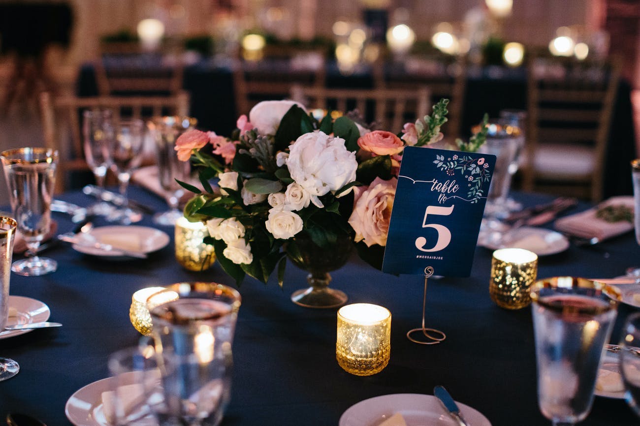 Blue and coral wedding tablescape.
