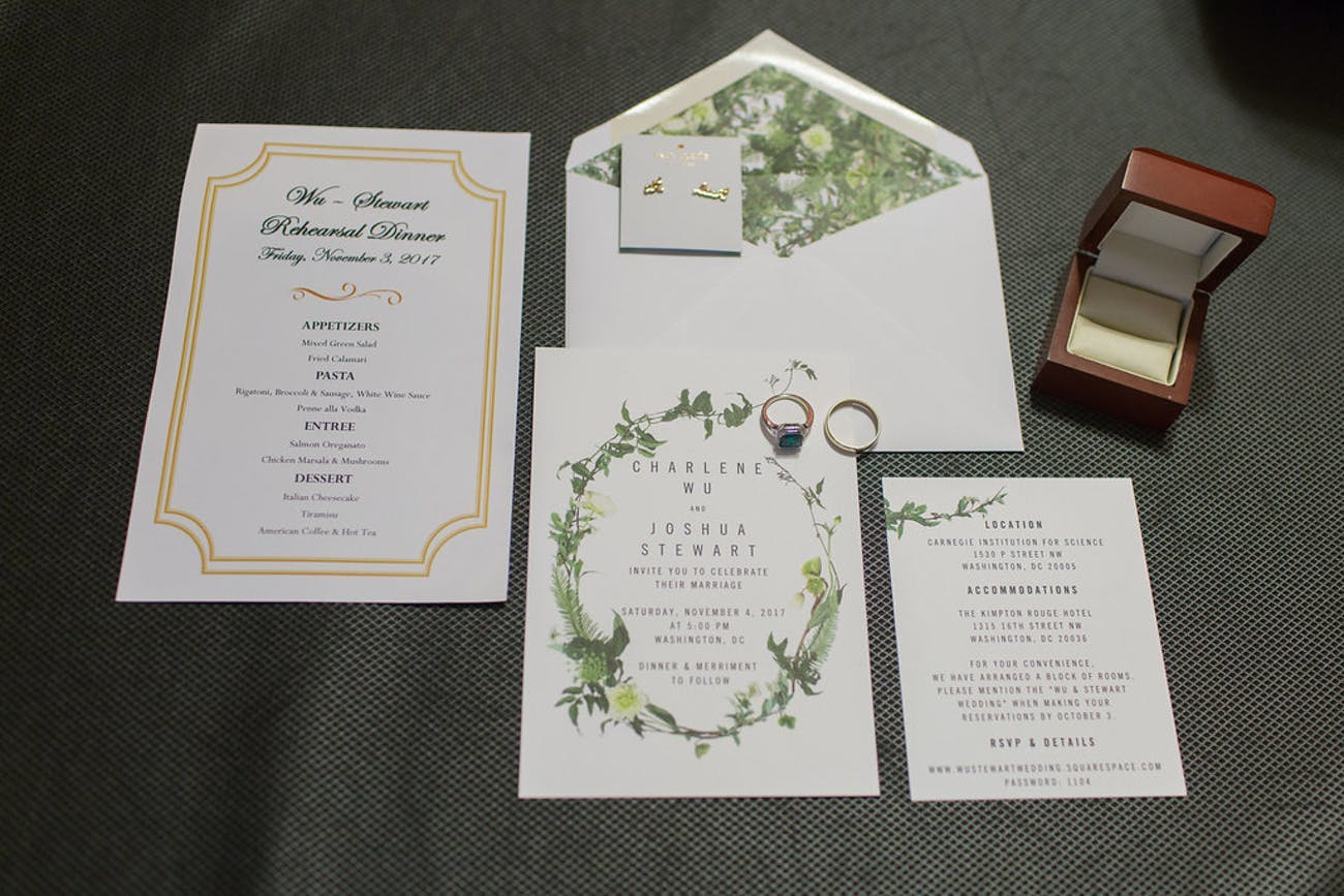 Rustic wedding invitations with greenery trimming | PartySlate