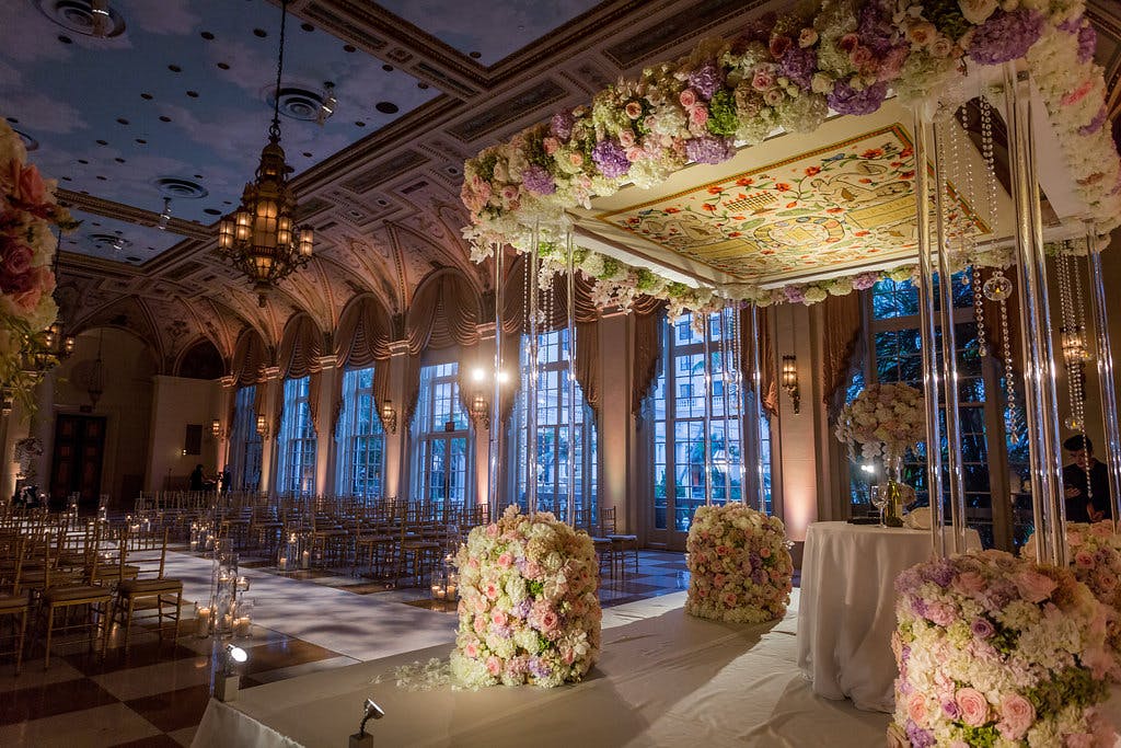 Garden Inspired Wedding at The Breakers Palm Beach with Floral Pattern Beneath Chuppah | PartySlate