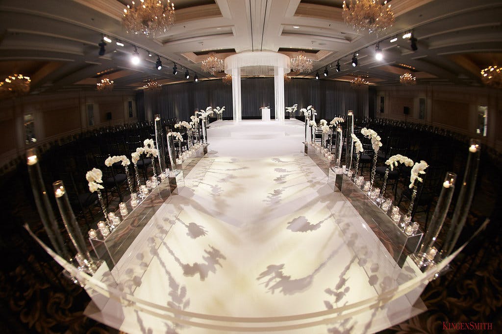 Unique Wedding Ceremony Idea with Floral Shadows on Wedding Aisle | PartySlate