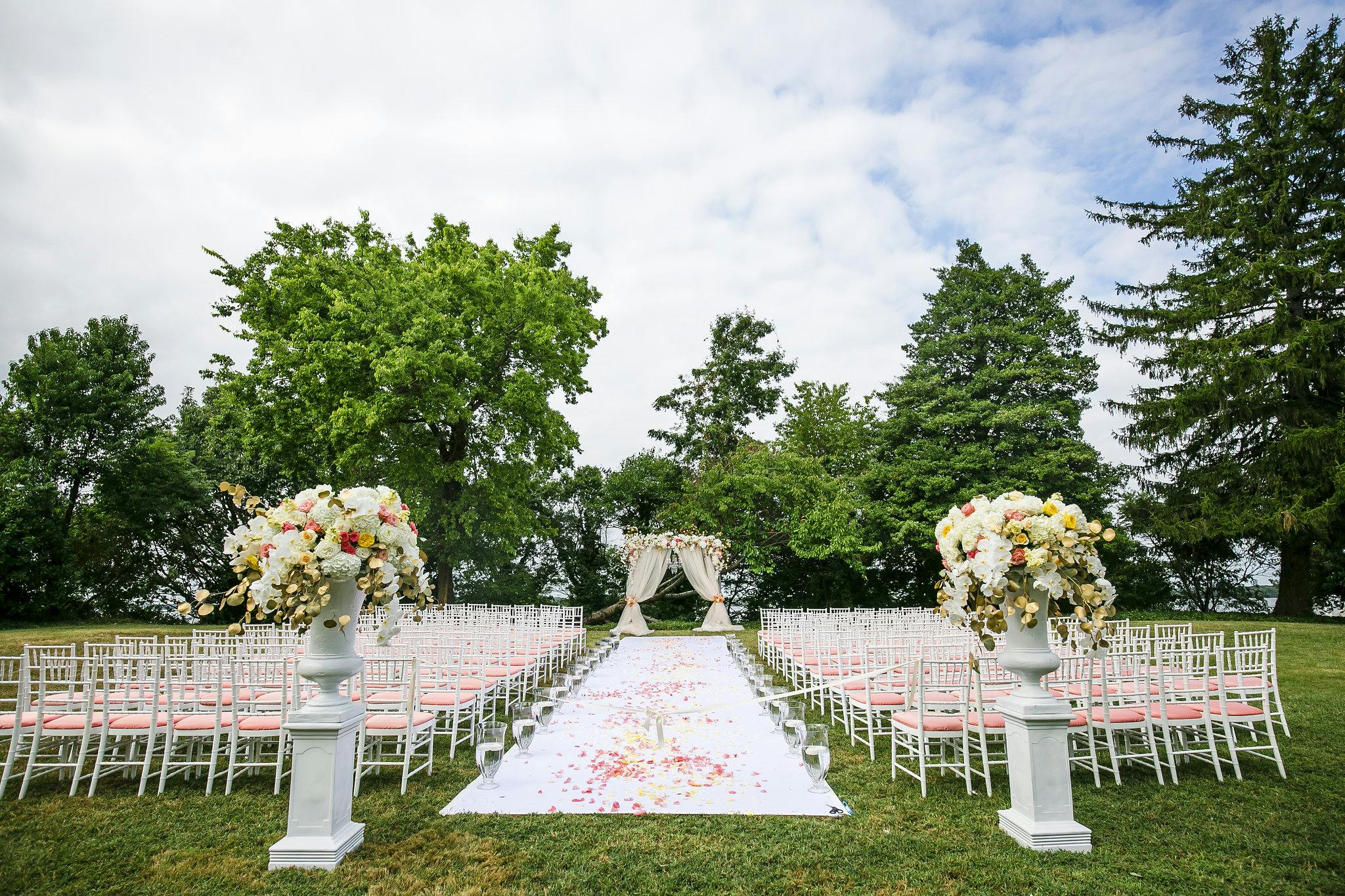 Outdoor Wedding Ceremony With Unique Pink Seat Cushions | PartySlate