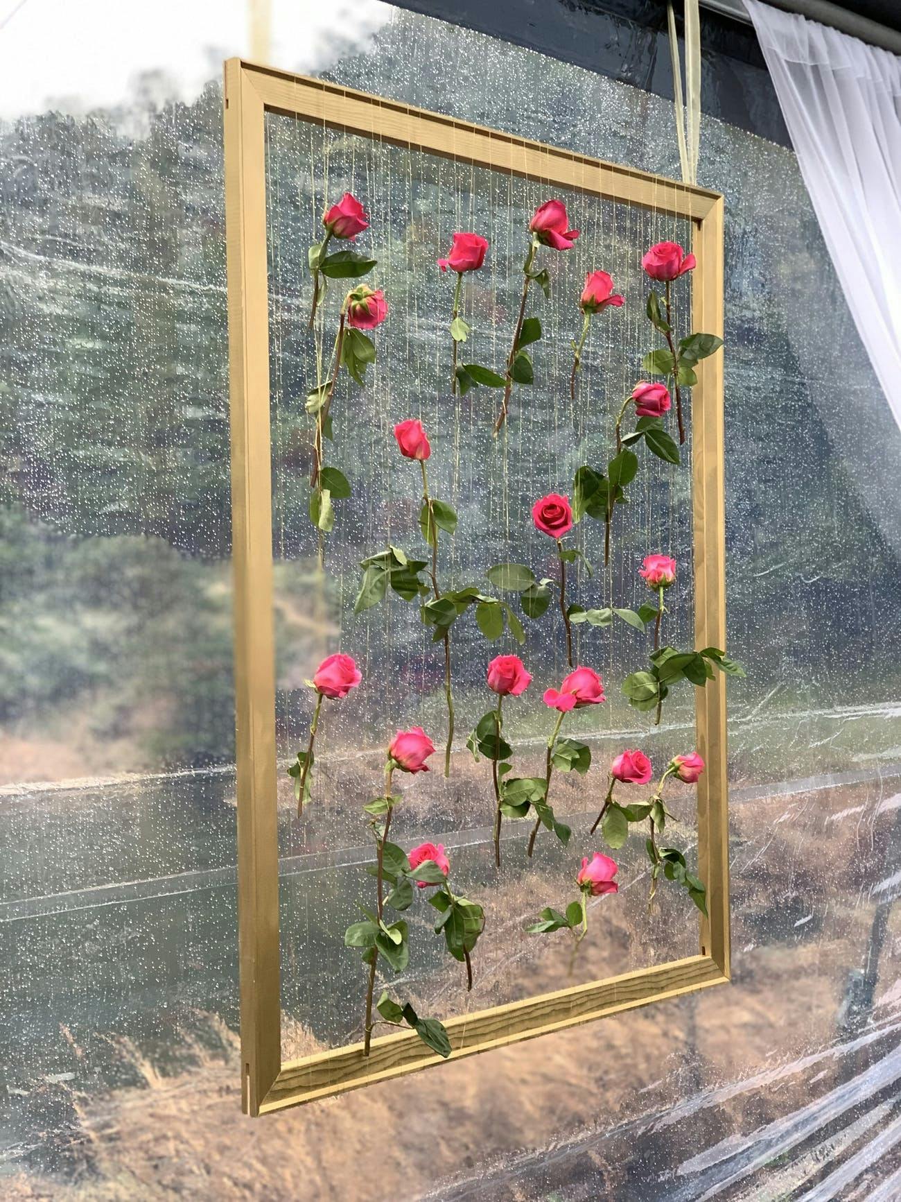 A Hanging Wood Frame with Pink Roses